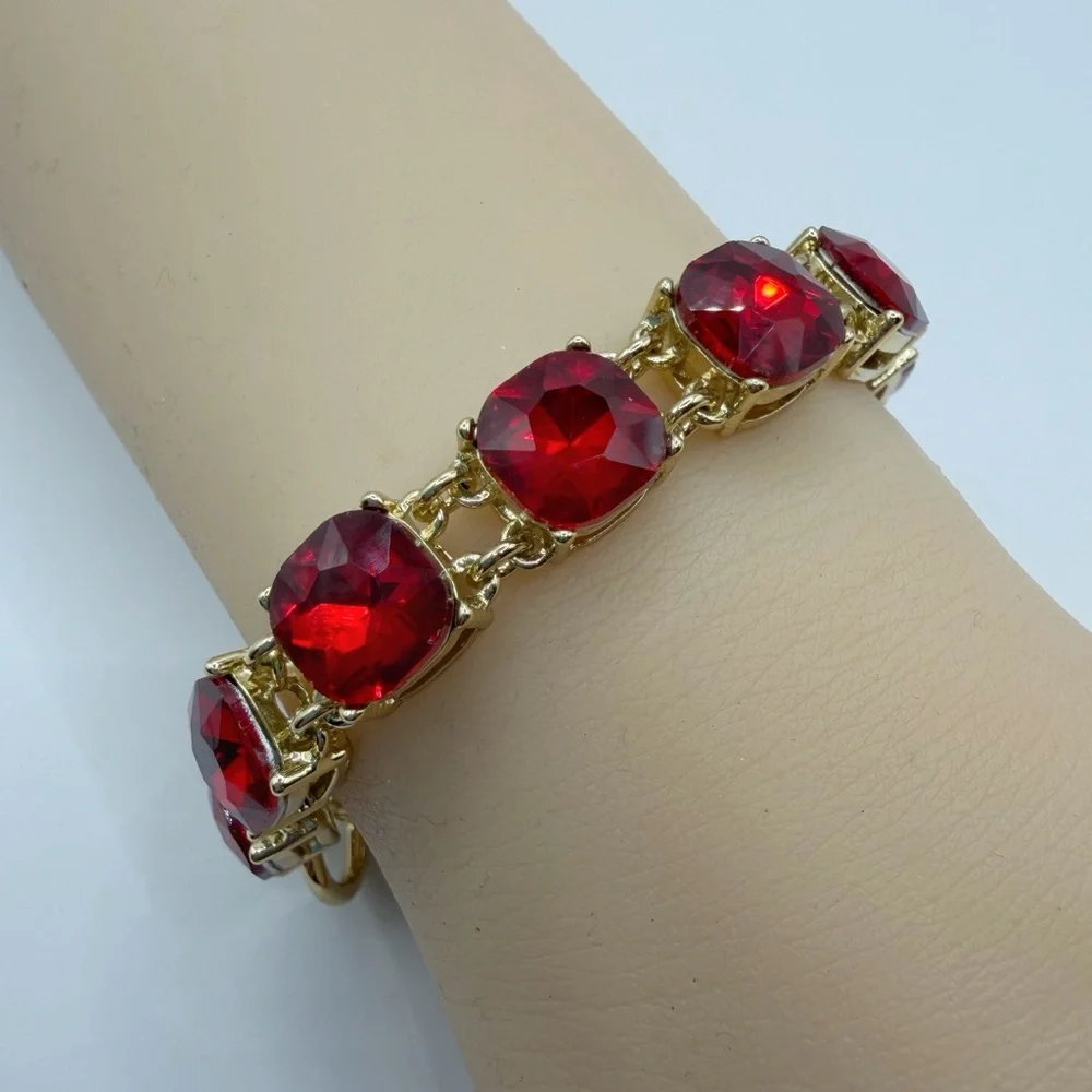 Cosmopolitan Gold Tone Red Crystal Bracelet | Cushion Cut Toggle Clasp
